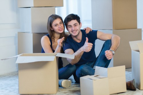Professional man and van team transporting furniture in Greenwich