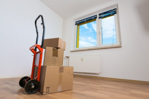 Packed boxes and furniture stored safely in a Greenwich self storage unit